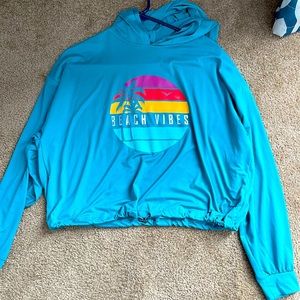 Crop pullover sweatshirt, teal in color, UK2LA size small